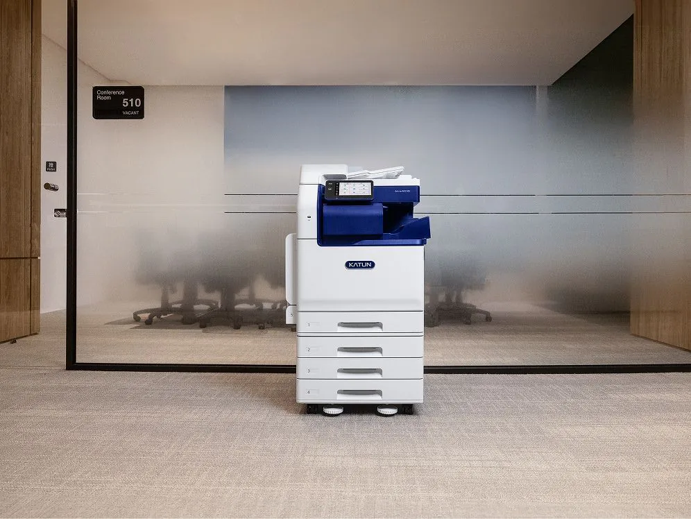 Katun-branded multifunction printer outside a conference room